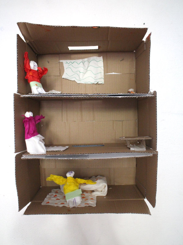 a tall multi-storey cardboard model